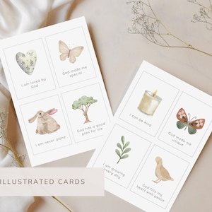May include: Two white rectangular cards featuring eight individual squares with watercolor illustrations and text. Illustrations include a heart, butterfly, rabbit, tree, candle, leaf, and duck. Text includes phrases like I am loved by God.