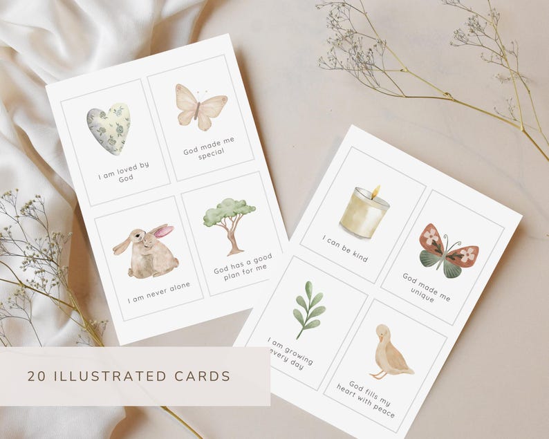 May include: Two white rectangular cards featuring eight individual squares with watercolor illustrations and text. Illustrations include a heart, butterfly, rabbit, tree, candle, leaf, and duck. Text includes phrases like I am loved by God.