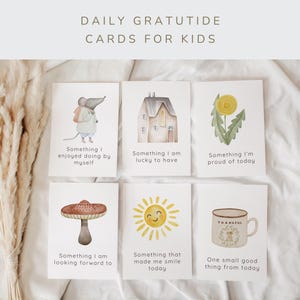 May include: Six white rectangular cards titled Daily Gratitude Cards for Kids. Each card features a watercolor illustration and text: a mouse, a house, a yellow flower, a mushroom, a sun, and a mug with the word Thankful printed on it.