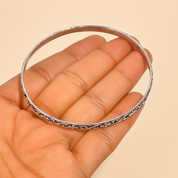 Bijou alliage argenté bracelet breloques signé Pilgrim bangle