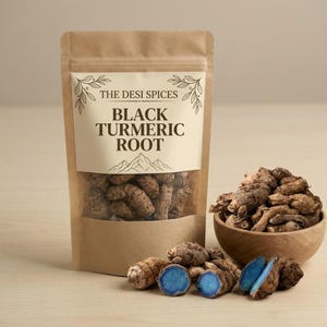 May include: A brown paper bag of Black Turmeric Root from The Desi Spices, with a clear window. A wooden bowl contains more of the root, and some pieces are cut open, showing a bright blue interior. The product is a spice.