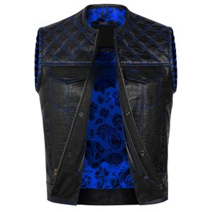 May include: Black leather vest with blue stitching and a quilted pattern on the shoulders. The vest features a crocodile texture and a blue paisley lining. It has a zipper closure and two front pockets.