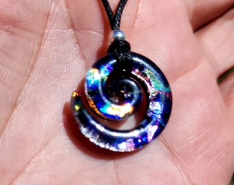 Small carved dichroic glass spiral rainbow galaxy on midnight silver pendant