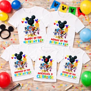May include: Five white short-sleeve t-shirts featuring a colorful Disney character graphic with Mickey Mouse ears and balloons. The shirts display text including Daddy of the Birthday Boy, Mommy of the Birthday Boy, Brother, Sister, and Michael's Clubhouse.
