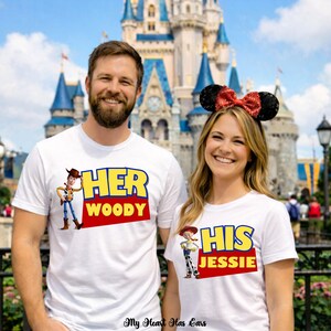 May include: Two white t-shirts featuring Toy Story character graphics. The left shirt displays Woody with the text HER WOODY. The right shirt displays Jessie with the text HIS JESSIE. The right shirt is worn with black sequin ears and a red bow.