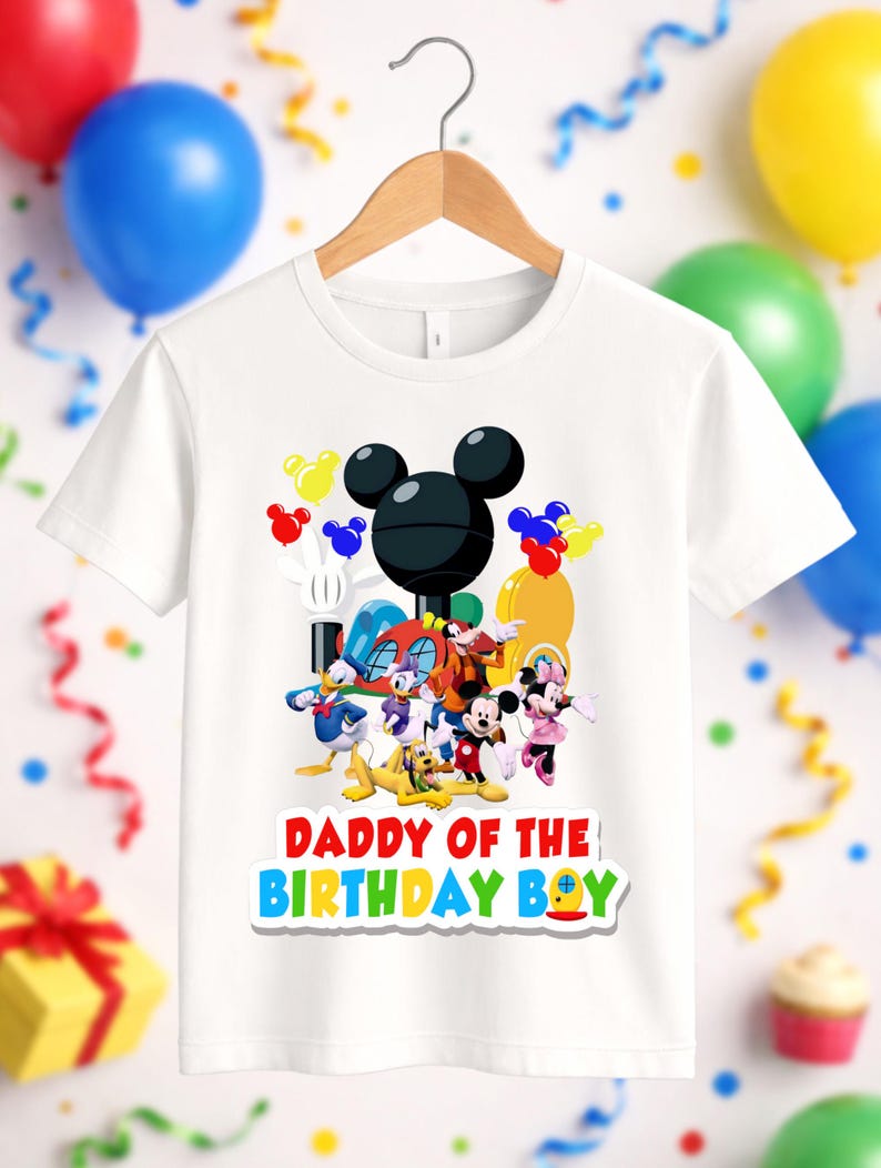 May include: A white short-sleeved t-shirt featuring a graphic of Mickey Mouse and friends, including Donald Duck, Daisy Duck, Goofy, Pluto, and Minnie Mouse. The text DADDY OF THE BIRTHDAY BOY is printed in colorful letters below the characters.