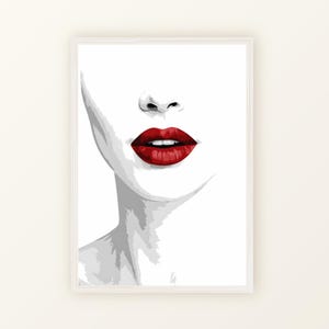 Könnte beinhalten: Ein gerahmter Kunstdruck mit einer minimalistischen Illustration eines Gesichts. Das Kunstwerk konzentriert sich auf das untere Gesicht und hebt Nase und volle, rote Lippen vor einem weißen Hintergrund hervor. Die Graustufen kontrastieren mit den leuchtend roten Lippen.