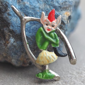 Pixie and wishbone vintage silver tone Hollywood brooch