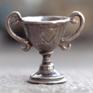 Trophy vintage silver charm or pendant