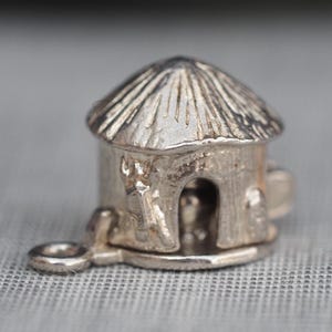 Tribal Hut vintage silver charm or pendant opens to show man in stew pot
