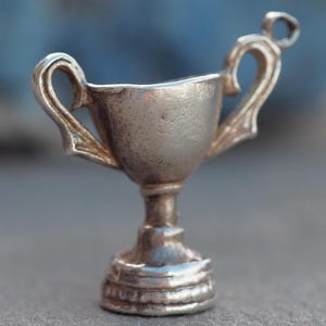 Trophy vintage silver charm or pendant