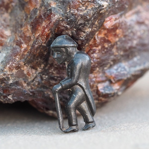 Miniature vintage metal figure of a man with walking stick