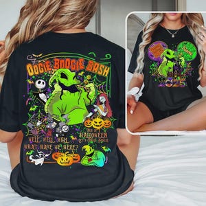 May include: Black t-shirt with a colourful Halloween-themed graphic. The design includes the text "Oogie Boogie Bash" and "2025", along with cartoon characters, pumpkins, and spiderwebs, perfect for a spooky celebration.