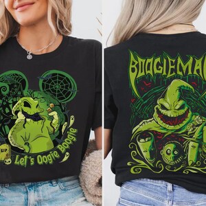 Puede incluir: Camiseta negra con un dise&ntilde;o verde de Oogie Boogie y el texto "Let's Oogie Boogie" en la parte delantera. La parte trasera de la camiseta muestra un gr&aacute;fico verde de "Boogieman". El dise&ntilde;o es de estilo caricatura.