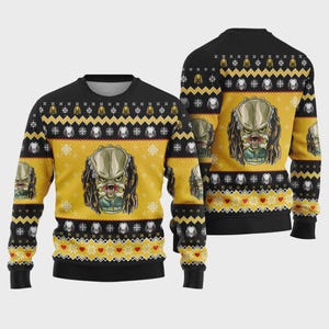 May include: Black and yellow holiday sweater featuring a Predator graphic. The sweater has a crew neck and long sleeves. The design includes snowflakes, hearts, and a repeating Predator face pattern. The sweater is a festive and unique holiday garment.