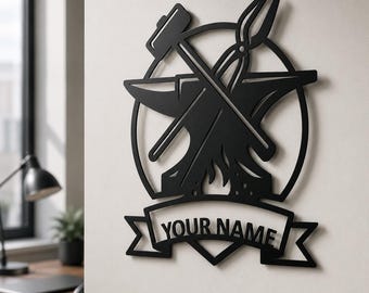 May include: A black metal wall sign featuring a circular frame containing a silhouette of an anvil, a hammer, and blacksmith tongs. Below the circular design is a banner with the text YOUR NAME cut out in a bold, sans-serif font.