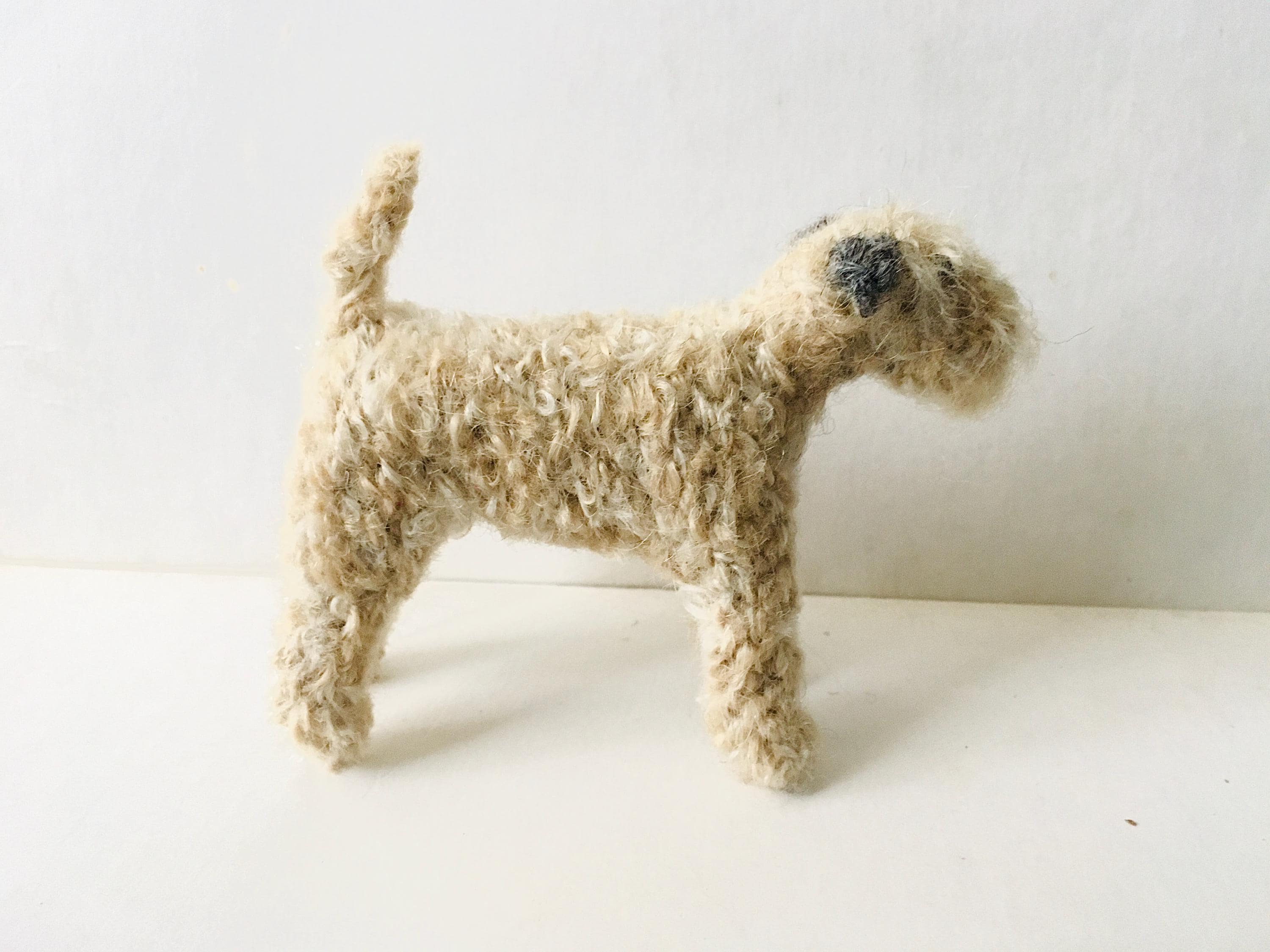 Ready to go! Little Soft Coated Wheaten Terrier with grey ears knitted in mohair