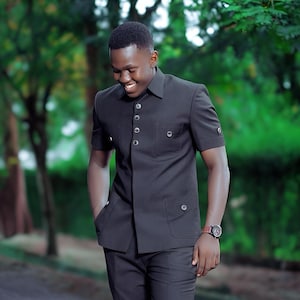 Jeeva Fashions New Stylish Partywear Formal Black Color Suiting Fabric Designer Safari Suit For Men.