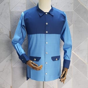 Jeeva Fashions New Stylish Partywear Formal Blue Double Shade Color Suiting Fabric Designer Safari Suit For Men.