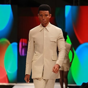 Jeeva Fashions New Stylish Partywear Formal Off White Color Suiting Fabric Designer Safari Suit For Men.