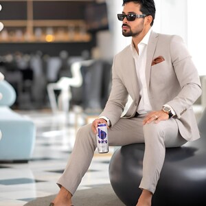 Jeeva Fashions New Stylish Partywear Formal Grey Color Designer Coat Pant Suit For Men.