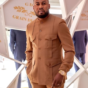 Jeeva Fashions New Stylish Partywear Formal Beige Color Suiting Fabric Designer Safari Suit For Men.
