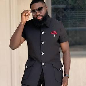 Jeeva Fashions New Stylish Partywear Formal Black Color Suiting Fabric Designer Safari Suit For Men.
