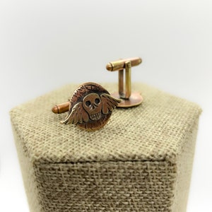 Skull cuff links