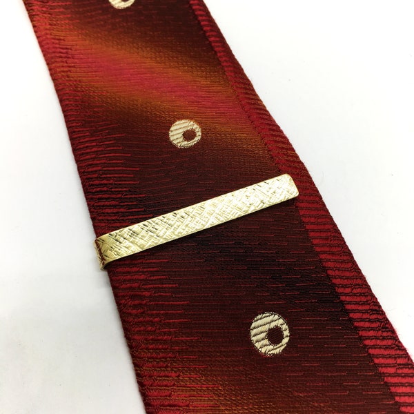 Brass tie clip with cross hatch hammered texture