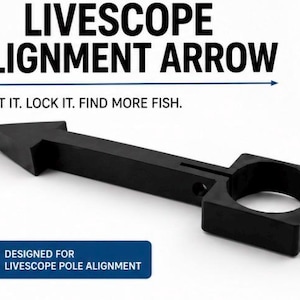 May include: A black Livescope alignment arrow tool featuring a pointed end and a circular opening for pole attachment. The text reads: LIVESCOPE ALIGNMENT ARROW, POINT IT. LOCK IT. FIND MORE FISH. DESIGNED FOR LIVESCOPE POLE ALIGNMENT.