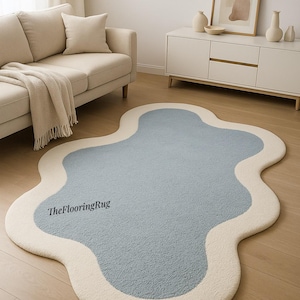 Blue and cream cloud-shaped 3x5 rug with a wavy, abstract design. A unique, plush, and modern accent for Funky living room and Bedroom.