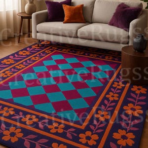 May include: A rectangular area rug with a geometric design. The rug features a central pattern of teal and magenta diamonds, framed by a border of orange flowers and a dark purple background. The rug is placed in a living room setting.