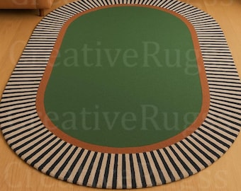 Mid-Century Modern Oval Rug: Hand Tufted Wool Hunter Green Center with Bold Black and Beige Radial Stripes and Terracotta Border Accent 8x10
