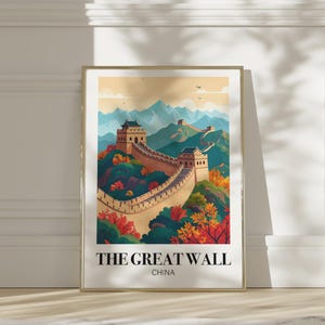 May include: A framed art print featuring a stylized illustration of the Great Wall of China. The artwork depicts the wall winding through a colorful landscape of mountains and trees, with text that reads "THE GREAT WALL CHINA".