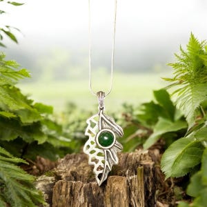 May include: A set of three ceramic mugs with a speckled, matte finish. The mugs are in shades of cream, light gray, and dark gray. Each mug has a simple, minimalist design and a rounded handle. Perfect for coffee or tea.