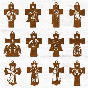 Könnte beinhalten: Ein Set aus zwölf hölzernen Kreuzanhängern mit verschiedenen religiösen Motiven. Jedes Kreuz hat einen Stern an der Spitze und zeigt Szenen wie die Geburt Christi, betende Hände und Engel. Die Kreuze sind braun.