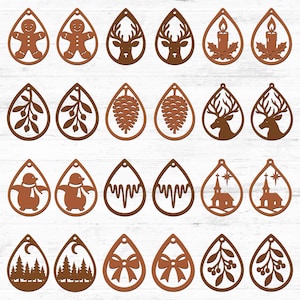 May include: A selection of brown wooden teardrop earrings featuring festive designs. The collection includes gingerbread men, reindeer, candles, pine cones, penguins, churches, bows, and forest scenes, all cut out.
