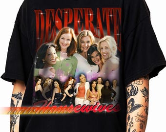 May include: Black t-shirt featuring a graphic of the cast of Desperate Housewives. The design includes the word "DESPERATE" in red, sparkling letters above a collage of the actresses. The words "northshoreewives" are at the bottom.