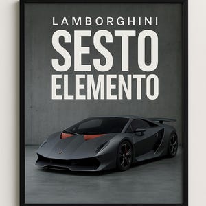 May include: Framed print of a grey Lamborghini Sesto Elemento. The car has orange detailing and a rear spoiler. The text 'Lamborghini Sesto Elemento' is displayed in large white letters above the car.