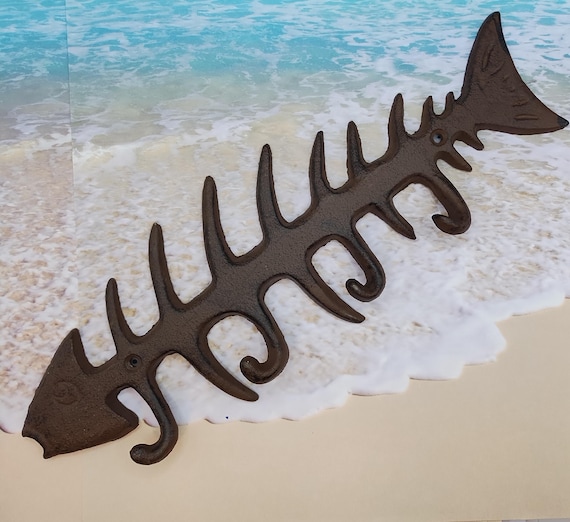 cast iron fish hook Large w/curved tail Sturdy construction Black in color Mounting hardware included Cast Iron Fish Bones Wall