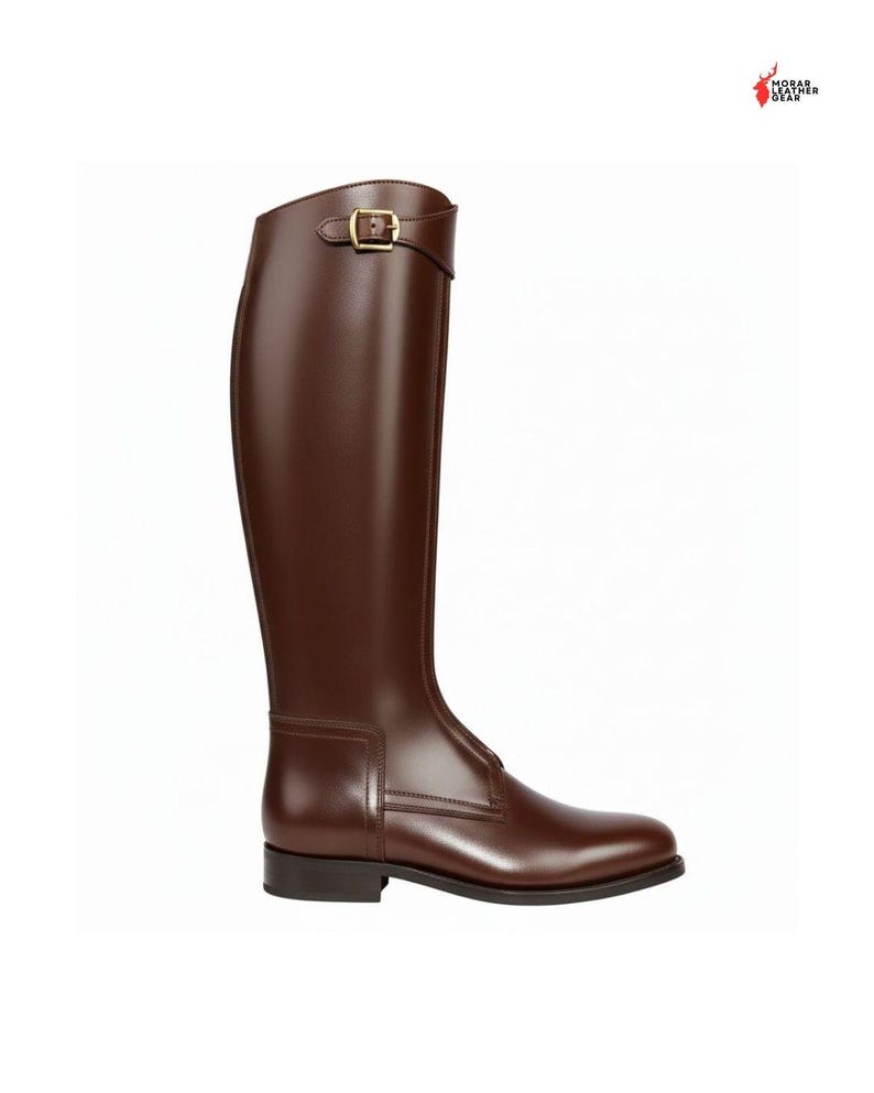 May include: A tall, brown leather riding boot with a gold-colored buckle. The boot has a smooth, polished finish and a low heel. The boot's height is approximately 16 inches.