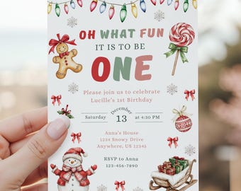 May include: A festive invitation for a first birthday celebration. The design features a gingerbread man, a snowman, and a candy cane. The text reads "OH WHAT FUN IT IS TO BE ONE". The date is December 13th at 4:00 PM.