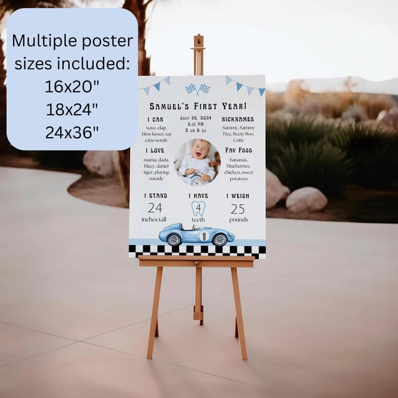 May include: A personalized first-year milestone poster on an easel. The poster features a baby's photo, stats, and a blue race car illustration. Includes text: "Samuel's First Year!" and "Multiple poster sizes included: 16x20", 18x24", 24x36".