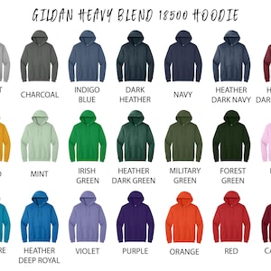 May include: A display of Gildan Heavy Blend 18500 hoodies in various colors, including white, black, navy, and red. The image shows the different color options available for the hoodie, with the name of each color displayed below.