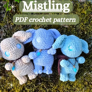 May include: Three plush crochet dolls in beige, light blue, and medium blue, each featuring large round eyes and a small bottle pendant necklace. The text Mistling PDF crochet pattern is displayed above the dolls in a white font.