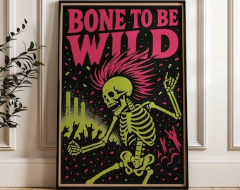 May include: A framed rectangular wall art print featuring a black background with the pink text BONE TO BE WILD at the top. A lime green skeleton with a pink mohawk is depicted in a dancing pose, surrounded by silhouettes of hands making rock signs.