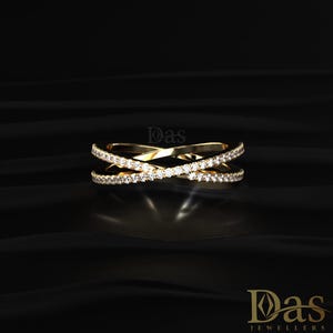 Luxury 14K yellow gold crossover ring featuring double crisscross bands lined with brilliant round moissanite stones for maximum sparkle and elegance. This modern stacking ring combines a refined open design with timeless diamond-inspired beauty, making it ideal as an anniversary ring, wedding jewelry, promise gift, or chic everyday accessory. The sleek intersecting bands and shimmering pavé moissanite details create a sophisticated and fashionable statement ring for women who love fine jewelry.
