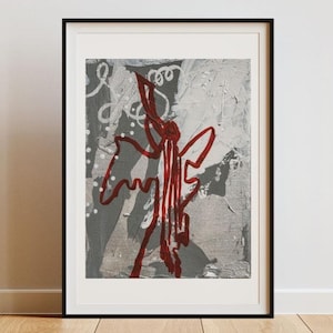 May include: Framed abstract art print featuring a red, linear design on a textured gray and white background. The artwork is displayed in a black frame, adding a modern touch to the piece. The painting is mounted on a white wall.