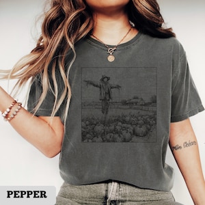 Scarecrow in pumpkin patch T-Shirt, rustic farm harvest tee, vintage fall countryside horror shirt, black white Halloween autumn top
