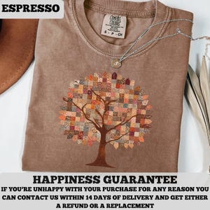 May include: Espresso-colored t-shirt featuring a tree design with a patchwork-style canopy. The shirt has a crew neck and short sleeves. The text "ESPRESSO" is at the top left. The text "HAPPINESS GUARANTEE" is at the bottom.